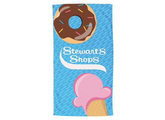 Towel with donut and ice cream design featuring 'Stewart's Shops' branding on a blue background.
