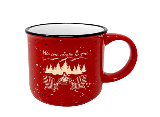 red mug. We are closer to you with a fire and two chairs. 