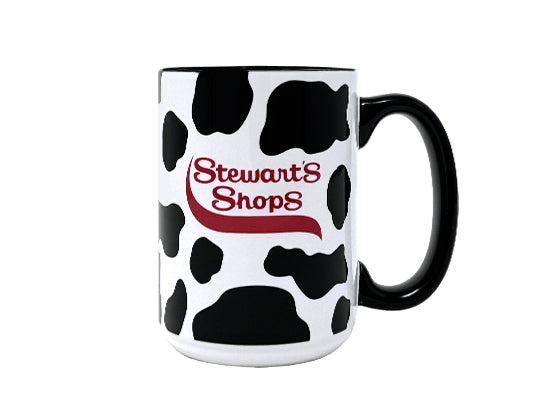 Cow print mug with 'Stewart's Shops' logo on a white background