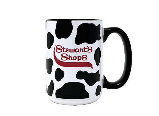 Cow print mug with 'Stewart's Shops' logo on a white background