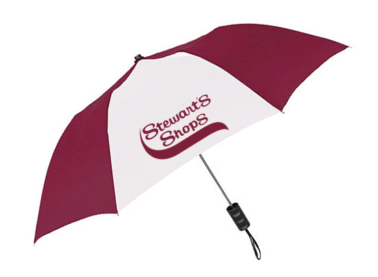 A maroon and white umbrella with alternating panels, featuring the Stewart’s Shops logo printed prominently on one of the white panels. The umbrella has a straight black handle with a wrist strap attached.
