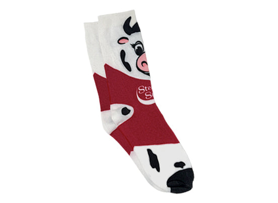 Sock with cartoon cow design on a white background