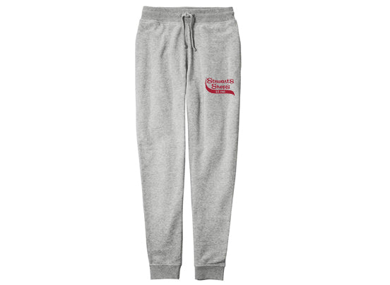 Gray sweatpants with a Stewart's Shops logo on the upper left thigh. 