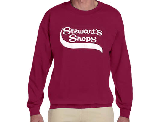 Maroon Crewneck sweatshirt with Stewart's Shops logo on a person wearing tan pants