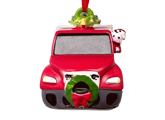 Red car ornament with Christmas wreaths and a cow on a white background