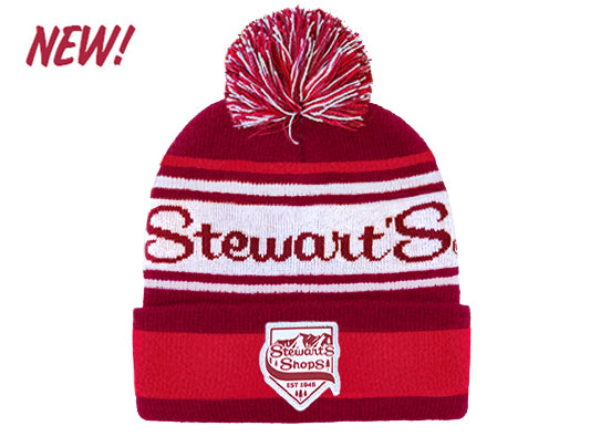 Red and white beanie with pom-pom and 'Stewart's' branding on a white background