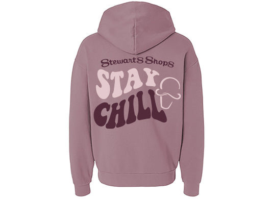 Pink hoodie with 'Stay Chill' text on the back against a white background