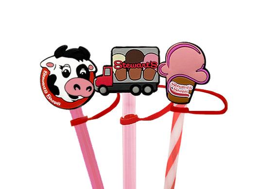 Three colorful straw toppers featuring a cow, truck, and ice cream cone design on a white background.