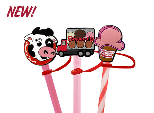 Three colorful straw toppers with cartoon cow, truck, and ice cream cone design on a white background.