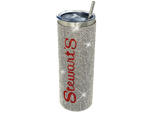 A bejeweled tumbler that says Stewarts down the side and a metal straw